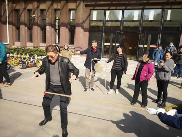 A group of people walking outside a building
Description automatically generated with low confidence